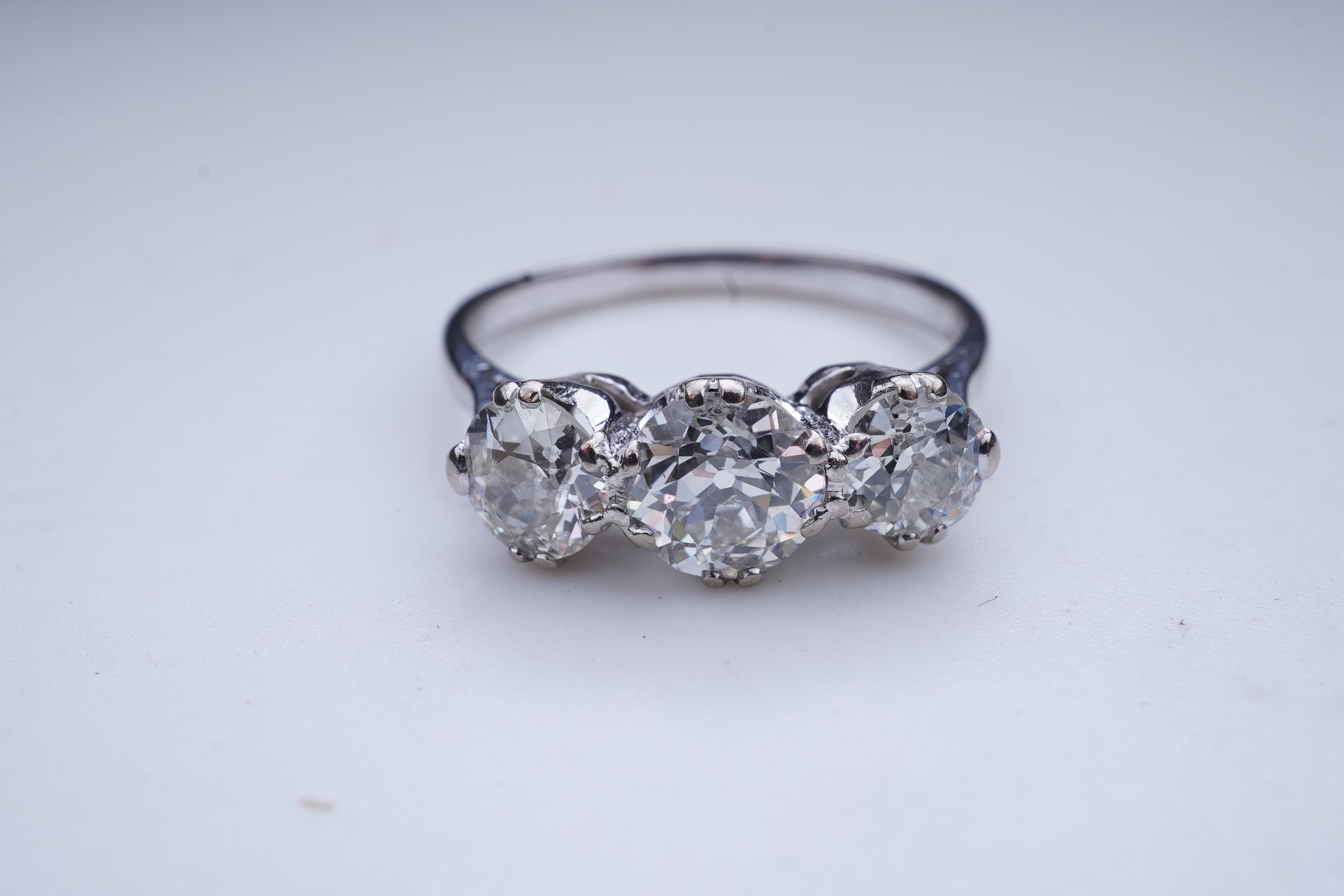 A three-stone diamond ring, early 20th century